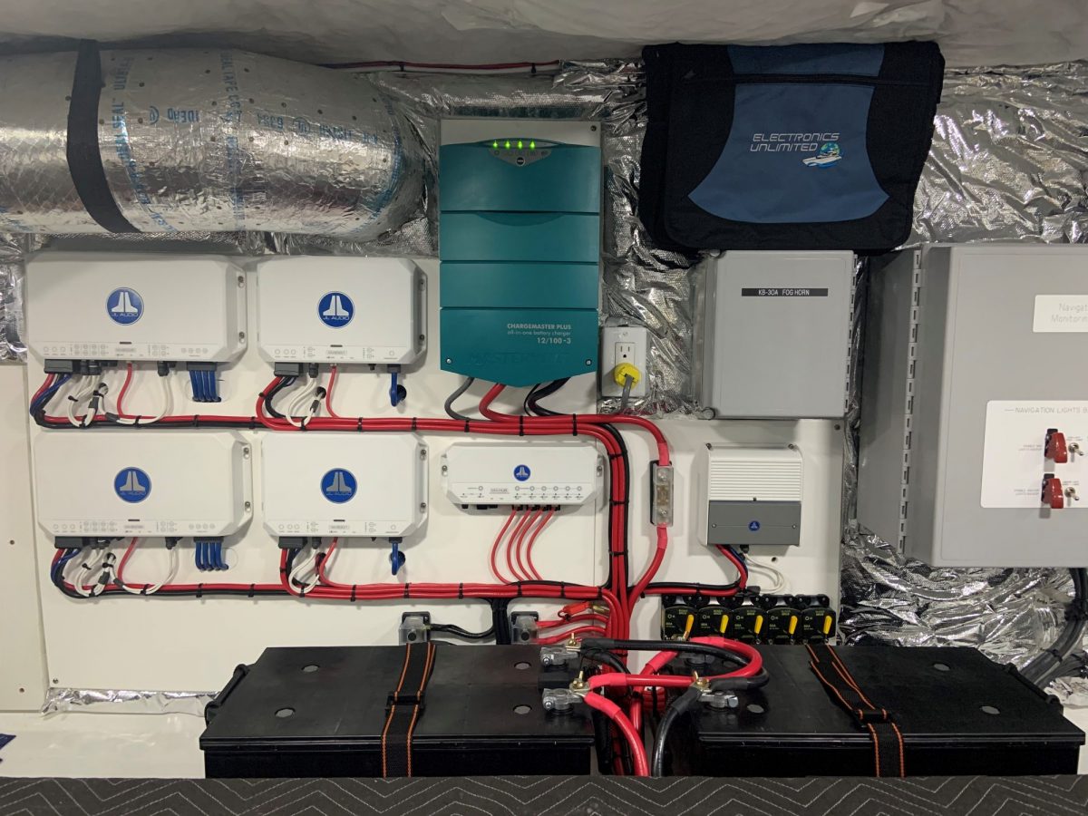 JL Audio amplifiers and battery bank installed in a vessel equipment space
