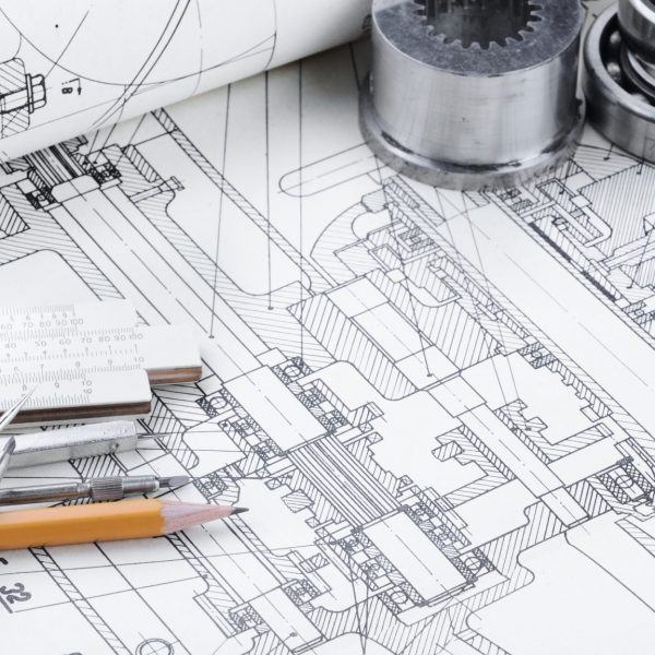 Marine electronics system drawings and schematics on a workbench