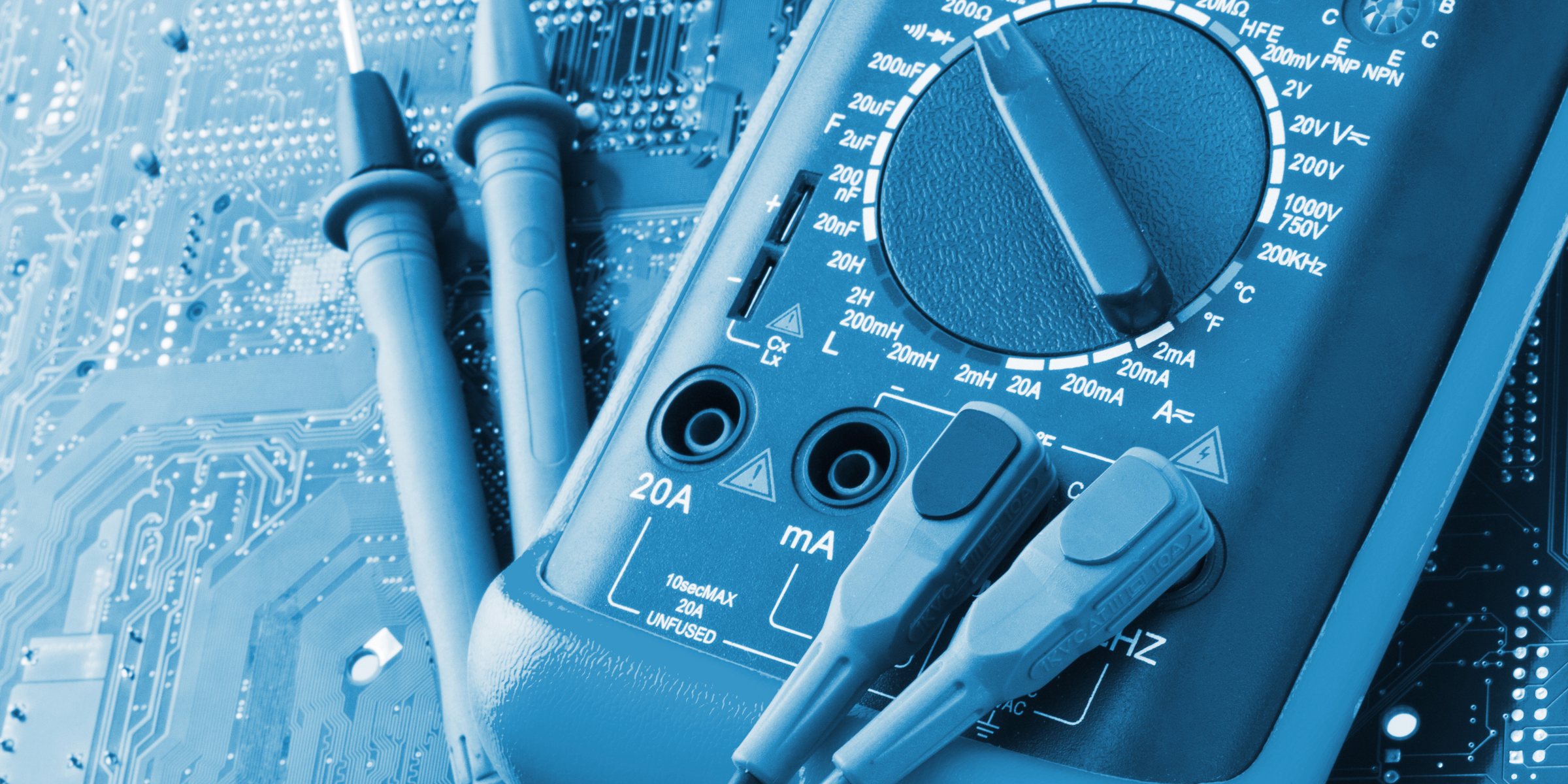 Multimeter and test probes on a circuit board