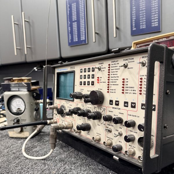 Oscilloscope and test equipment on the Electronics Unlimited service bench