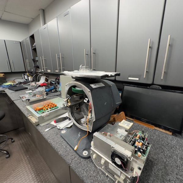 Marine radar scanner opened on the Electronics Unlimited service bench for repair